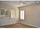 Bright bedroom with plantation shutters and tile flooring, offering a serene retreat at 7979 E Princess Dr # 8, Scottsdale, AZ 85255
