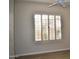 Bedroom with shuttered window and ceiling fan offers a bright, airy ambiance at 7979 E Princess Dr # 8, Scottsdale, AZ 85255