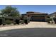 Charming single-story home featuring a tile roof, desert landscaping, and a two-car garage at 7979 E Princess Dr # 8, Scottsdale, AZ 85255