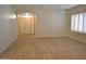 Spacious living area featuring tile floors, white shutters, and an arched entry way at 7979 E Princess Dr # 8, Scottsdale, AZ 85255