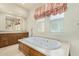 Bathroom features soaking tub with jetted option and neutral walls at 8298 E Tailfeather Dr, Scottsdale, AZ 85255