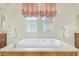 Bathroom featuring soaking tub with jetted option and neutral walls at 8298 E Tailfeather Dr, Scottsdale, AZ 85255
