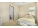 Bedroom showcasing ornate bed frame and access to the bathroom at 8298 E Tailfeather Dr, Scottsdale, AZ 85255