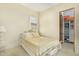 Bedroom with ornate bed frame, window with shutter and access to closet at 8298 E Tailfeather Dr, Scottsdale, AZ 85255