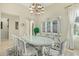 Elegant dining room featuring a crystal chandelier and ornate china cabinet at 8298 E Tailfeather Dr, Scottsdale, AZ 85255