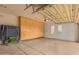 Spacious garage with epoxy floors, storage cabinets, and bright lighting at 8298 E Tailfeather Dr, Scottsdale, AZ 85255