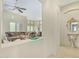 Spacious living room showcases an open layout with a comfortable sofa, ceiling fan, and elegant decor at 8298 E Tailfeather Dr, Scottsdale, AZ 85255
