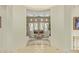 View of a stylish living room through an arched doorway at 8298 E Tailfeather Dr, Scottsdale, AZ 85255