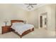 Neutral main bedroom featuring tray ceiling, ceiling fan, and sitting area at 8298 E Tailfeather Dr, Scottsdale, AZ 85255