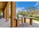 Outdoor kitchen with built-in grill and stone countertop on a brick patio at 8298 E Tailfeather Dr, Scottsdale, AZ 85255