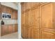 Spacious walk-in pantry with custom cabinetry and ample storage space at 8298 E Tailfeather Dr, Scottsdale, AZ 85255