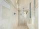 Beige tiled shower stall featuring built-in bench and shower head with wand at 8298 E Tailfeather Dr, Scottsdale, AZ 85255