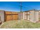 Backyard featuring a wooden fence and storage shed, offering privacy and functionality at 844 E Ruth Ave, Phoenix, AZ 85020