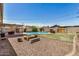 Spacious backyard with a pool, patio, and firepit area, perfect for outdoor living and entertaining at 844 E Ruth Ave, Phoenix, AZ 85020