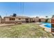 Large backyard with a refreshing pool, inviting fire pit, and plenty of space for entertaining at 844 E Ruth Ave, Phoenix, AZ 85020