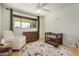 Sunlit Bedroom with a comfy chair, dresser, and crib, perfect for a growing Gathering at 844 E Ruth Ave, Phoenix, AZ 85020