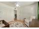 Bright bedroom with a comfy chair, large closet, and ceiling fan at 844 E Ruth Ave, Phoenix, AZ 85020