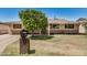 Charming single-story home featuring a well-maintained lawn and mature shade tree at 844 E Ruth Ave, Phoenix, AZ 85020