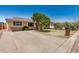 Attractive ranch-style home featuring lush front yard landscaping and a long driveway at 844 E Ruth Ave, Phoenix, AZ 85020