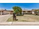 Single-story home with a well-manicured lawn and mature tree shading the facade at 844 E Ruth Ave, Phoenix, AZ 85020