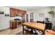 Eat-in kitchen with wooden cabinets, stainless steel appliances, a butcher block island and tile floors at 844 E Ruth Ave, Phoenix, AZ 85020