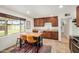 Kitchen with stainless steel appliances, wood cabinets, granite countertops, tile floors, and a breakfast bar at 844 E Ruth Ave, Phoenix, AZ 85020