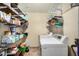 Spacious laundry room with shelving and modern washer and dryer at 844 E Ruth Ave, Phoenix, AZ 85020