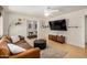 Comfortable living room with hardwood floors, modern lighting, and stylish furnishings at 844 E Ruth Ave, Phoenix, AZ 85020