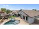Aerial perspective showcasing a pristine pool, spa, and outdoor living space, complemented by lush landscaping at 8776 E Brilliant Sky Cir, Gold Canyon, AZ 85118