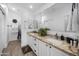 Elegant bathroom featuring double sinks, granite countertops, and modern fixtures at 8776 E Brilliant Sky Cir, Gold Canyon, AZ 85118