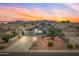 Charming single-Gathering home with desert landscaping, a well-maintained lawn, and mountain views at 8776 E Brilliant Sky Cir, Gold Canyon, AZ 85118
