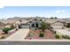 Charming front exterior featuring well-maintained landscaping, a concrete driveway, and a welcoming entrance at 8776 E Brilliant Sky Cir, Gold Canyon, AZ 85118