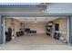 Spacious garage with epoxy flooring and ample storage solutions for organization and convenience at 8776 E Brilliant Sky Cir, Gold Canyon, AZ 85118