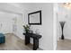 Hallway features modern decor, a sleek console table, mirror, and stylish lighting at 8776 E Brilliant Sky Cir, Gold Canyon, AZ 85118