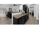 Open concept kitchen with a view into the living room, featuring stainless steel sink and appliances at 8776 E Brilliant Sky Cir, Gold Canyon, AZ 85118