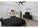 Spacious bedroom with large windows overlooking the pool area and modern decor at 8776 E Brilliant Sky Cir, Gold Canyon, AZ 85118