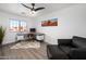 Well-lit office with a modern desk, comfortable seating, and a window offering natural light at 8776 E Brilliant Sky Cir, Gold Canyon, AZ 85118