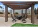 Outdoor pergola-covered patio featuring comfortable seating and a charming desert landscape at 8776 E Brilliant Sky Cir, Gold Canyon, AZ 85118