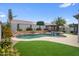 Backyard featuring a pool and spa, rock waterfall, and a patio at 8776 E Brilliant Sky Cir, Gold Canyon, AZ 85118