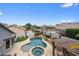 Stunning overhead shot of a backyard pool with a spa, patio, and beautifully landscaped surroundings at 8776 E Brilliant Sky Cir, Gold Canyon, AZ 85118