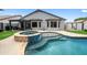 Sparkling pool and spa combo with stone accents, surrounded by lush greenery, perfect for relaxation at 8776 E Brilliant Sky Cir, Gold Canyon, AZ 85118