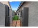 Side yard featuring secure black fencing, providing privacy and security for the property at 8776 E Brilliant Sky Cir, Gold Canyon, AZ 85118