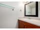 Bathroom features a mirror, a vanity and glass shelf for toiletries and linens at 921 W University Dr # 1232, Mesa, AZ 85201