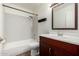 Bathroom features a shower-tub, a commode, and a vanity with a mirror for convenience at 921 W University Dr # 1232, Mesa, AZ 85201