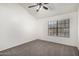Bright bedroom featuring neutral carpet, vaulted ceilings, and a window for natural light at 921 W University Dr # 1232, Mesa, AZ 85201