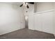 Bedroom features neutral carpet, ample closet space, and a tall ceiling at 921 W University Dr # 1232, Mesa, AZ 85201