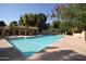 Community pool with a clear blue water, cabana, and surrounded by a concrete deck at 921 W University Dr # 1232, Mesa, AZ 85201