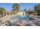 Community pool area with two cabanas, lounge seating, and a safety fence at 921 W University Dr # 1232, Mesa, AZ 85201