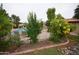 Lush landscaping around the pool area, enclosed with an iron fence for safety at 921 W University Dr # 1232, Mesa, AZ 85201