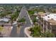 Scenic aerial shot of the neighborhood showing the streetscape and lush greenery surrounding the building at 9820 N Central Ave # 212, Phoenix, AZ 85020